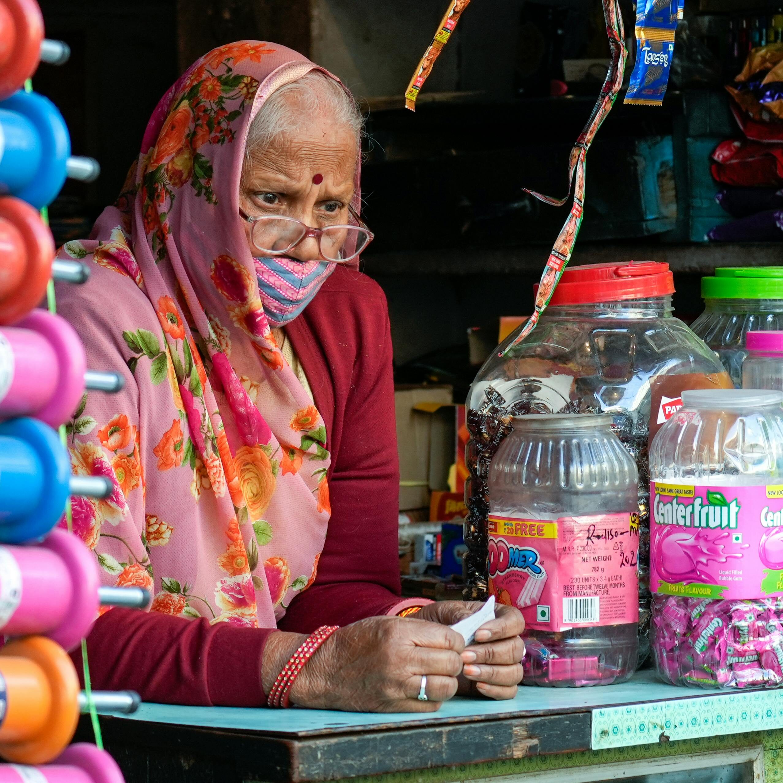 An old woman, earning her means to survive
