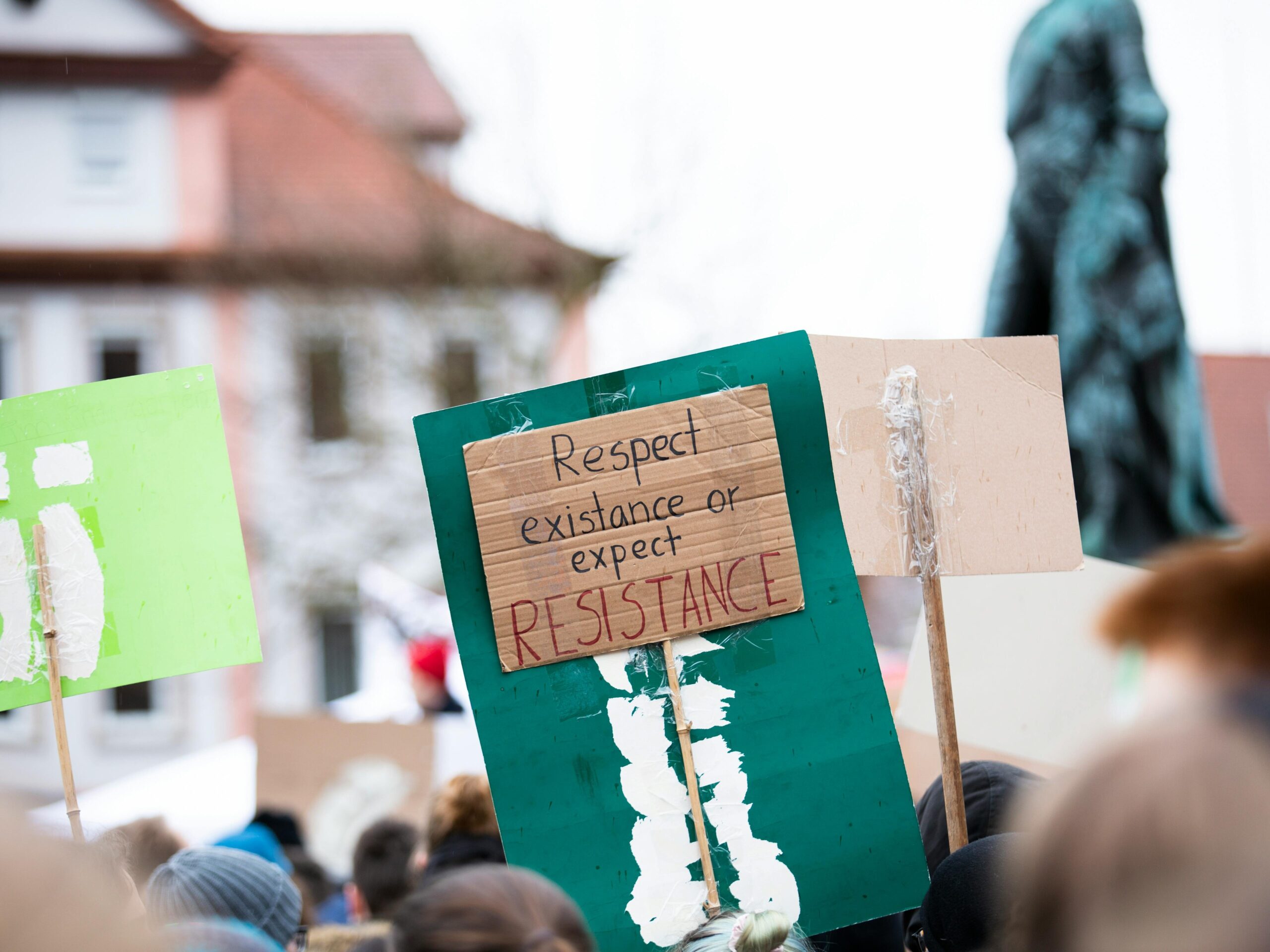 Protestors march with handmade signs in Erlangen, Germany, advocating environmental change: a demostration of youth leadership and advocacy.