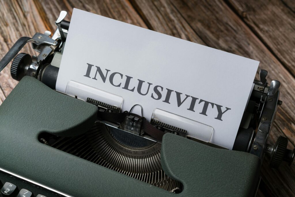 A vintage typewriter featuring a paper with the word 'Inclusivity,' symbolizing acceptance and diversity.